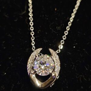 2.0CTW VVSD Moissanite Pendant with heart scroll on 18" Sterling Silver chain.